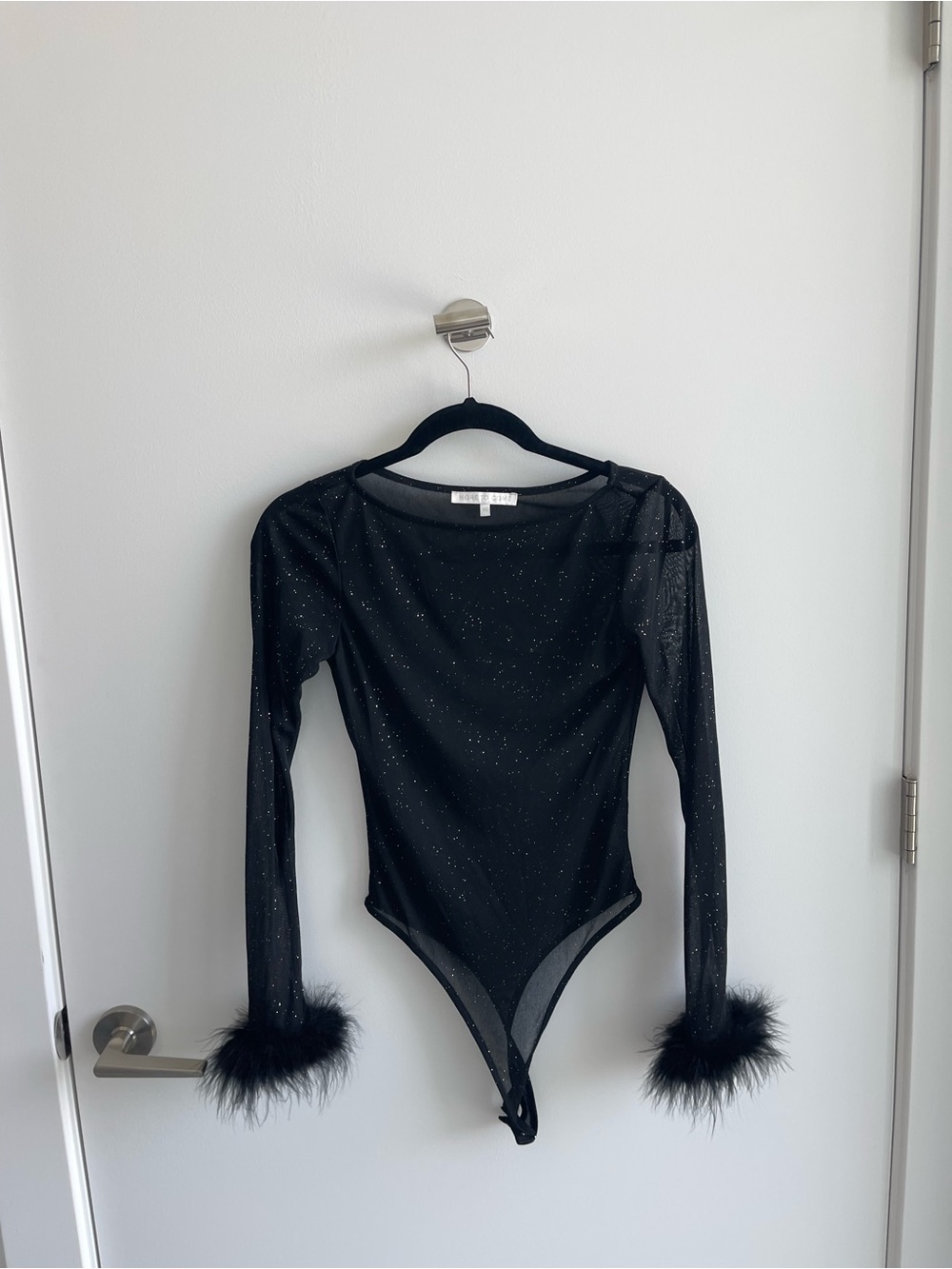 More to Come Black Sparkle Mesh Long Sleeve Bodysuit with Feather Cuffs